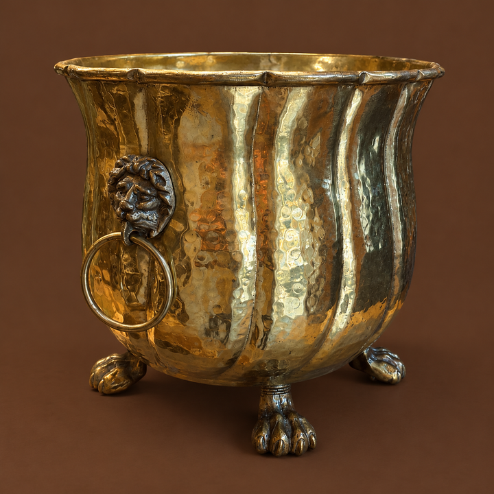 Brass planter claw footed with lion head handles