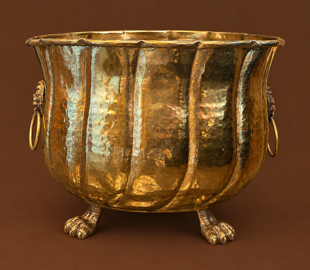 Brass planter claw footed with lion head handles