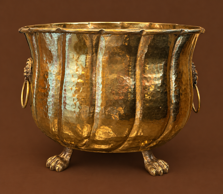 Brass planter claw footed with lion head handles